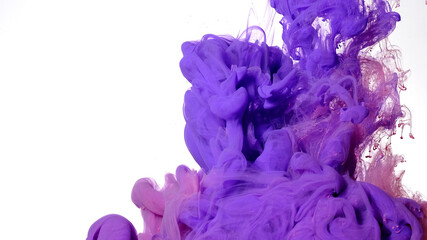 Purple and pink watercolor ink in water on a white background. Fascinating abstract background. Violet and pink paints are mixed in water.