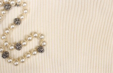 Pearls on Cream Colored Sweater Close up
