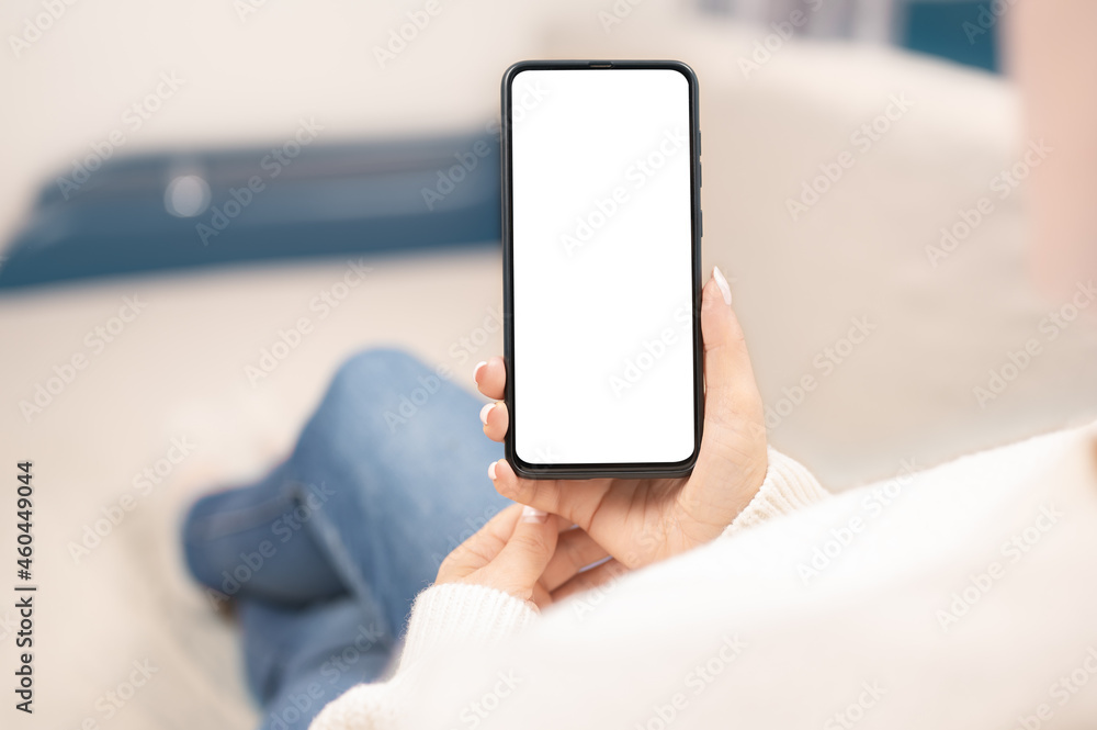 Poster working at home using with smart cell phone. woman using smartphone frameless mockup blank screen in