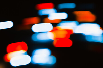 Abstract colorful design, multicolored lights in motion blur, festive backdrop bokeh on dark...