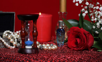 Obraz na płótnie Canvas Red Candle and Rose on Red Velvet Background