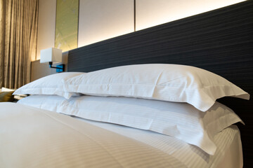Fototapeta na wymiar Basic - common style bedroom in luxurious hotel.