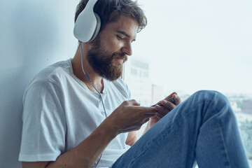 Man sitting in the room with headphones technology