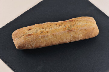 small French baguette on a blackboard