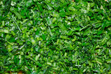 a few of finaly cut green dill and parsley close-up macro background herbs