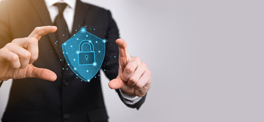 Businessman hold low poly polygon shield with a padlock icon.Secure Access System Concept.Business...