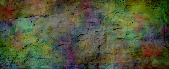 Multicoloured grunge rock face banner background - textured rough earthy richly deeply coloured...
