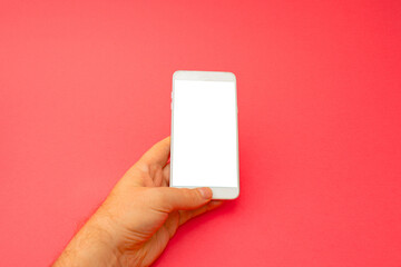 Fototapeta na wymiar Hand holding white 3d smartphone against red background. 3D illustration design template background. Top mobile phone message. Advertisement idea. Blank copy space for ad.