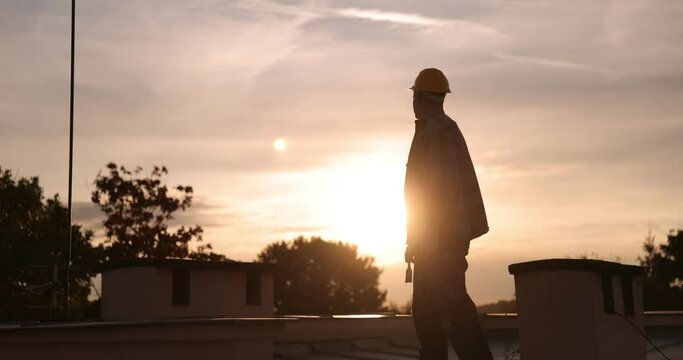 builder roofer painter worker painting the roof, 4k