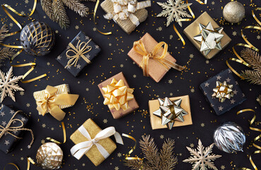 Holidays background with golden Christmas gift boxes