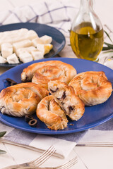 Pastry swirls with cheese and olive filling.