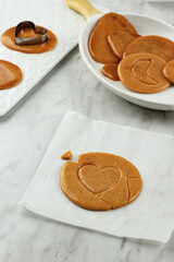 Dalgona Candy Squid Game (Ppopgi), Old Fashionaed Korean Sugar Candy with Stamp on the Center. Viral Food on Social Media.