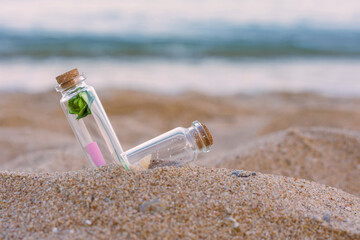 Message or letter in bottle on the tropical beach