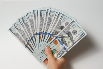 Hand with money isolated on white background