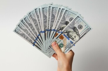 Hand with money isolated on white background
