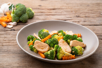Stir Fried Broccoli with chicken breast and carrot in oyster sauce.Thai food