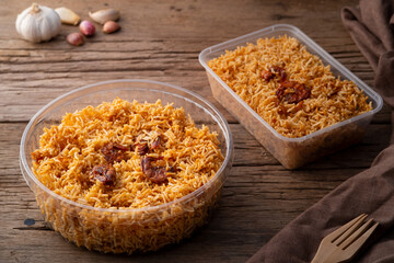 Thai dessert, Mixed Crispy Rice Noodle (Mee Krob) in Plastic food container on wood background