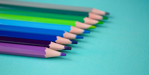 Colored pencils on a blue background