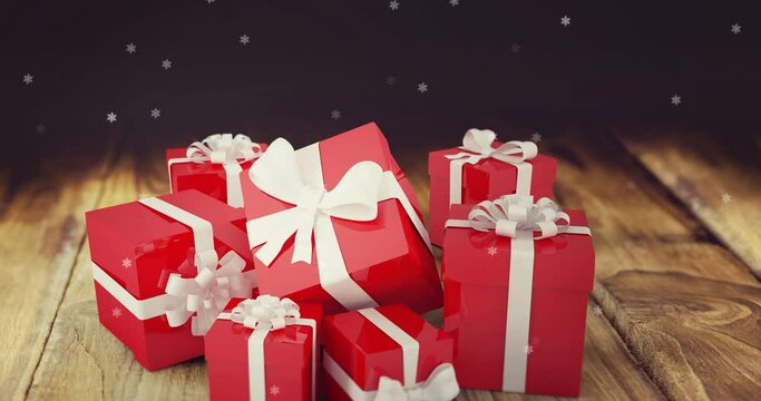 Animation of snow falling over presents on wooden background
