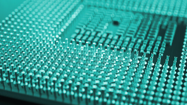 Computer processor close up. Turquoise tinted background or backdrop. Information technology wallpaper. A pattern of contacts and semiconductors of a pc microprocessor. Macro