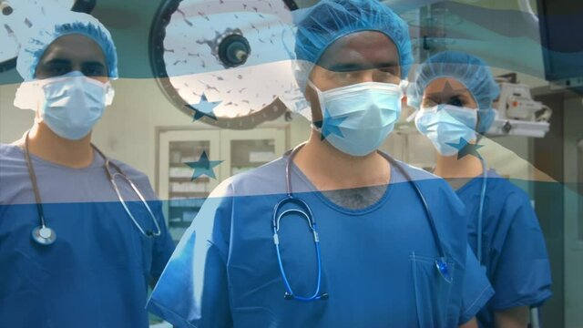 Animation of flag of honduras waving over surgeons in operating theatre
