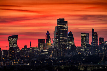 Fototapeta na wymiar The modern skyline of the financial district City of London, United Kingdom, during evening time with a colorful sky