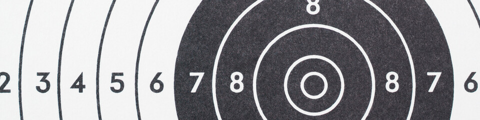 Target for shooting. Black and white banner or headline on the subject of shooting sports. Fragment...