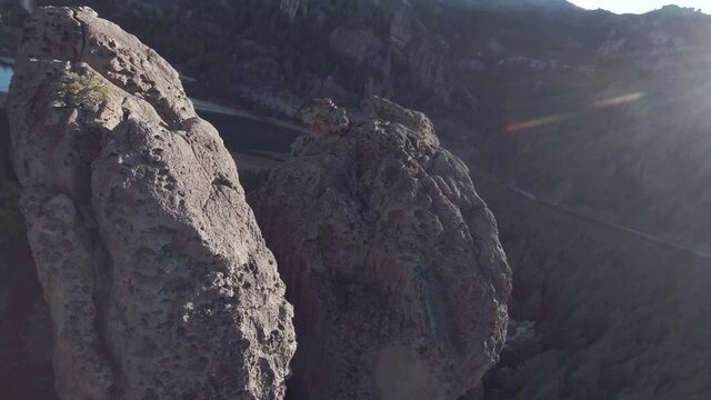 Flying between rocks formation in a valley with a river // FPV drone footage
