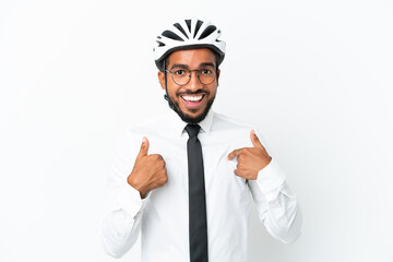 Young business latin man holding a bike helmet isolated on white background with surprise facial expression