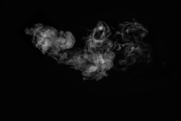 White smoke on black background. Figured smoke on a dark background. Abstract background, design element