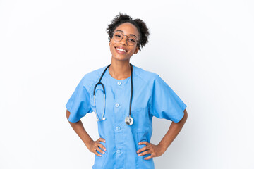 Young surgeon African American doctor woman isolated on white background posing with arms at hip...