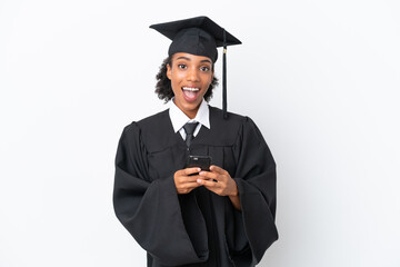 Young university graduate African American woman isolated on white background surprised and sending a message