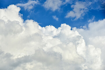 Naklejka na ściany i meble Beautiful white clouds on blue sky background.