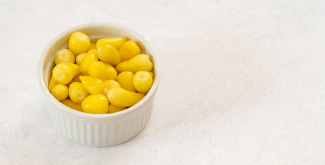 yellow hot pepper pickle on a white background. Copy space
