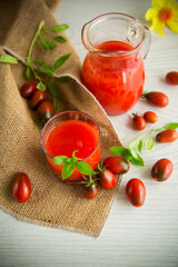 homemade freshly squeezed tomato juice with pulp in a glass decanter