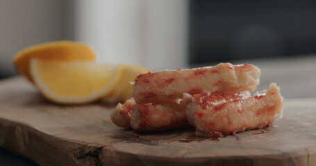 crab with sweet lemon on olive wood board