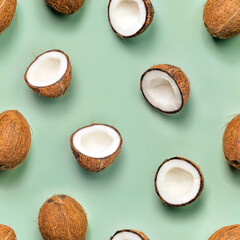 Seamless pattern with coconuts on green background. Top View. Summer concept.
