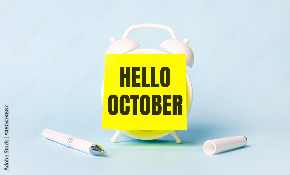 Poster on a light blue background - a white handle and an alarm clock with a bright yellow sticker glued to
