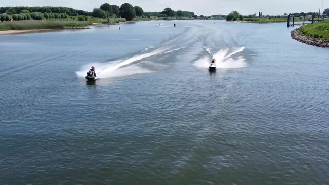 Aerial bird view of jet skis moving fast over water it is generically to refer to any type of personal watercraft used mainly for recreation and it is also used to describe the use of any type of PWC
