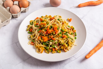 Rice noodles with eggs and vegetables.