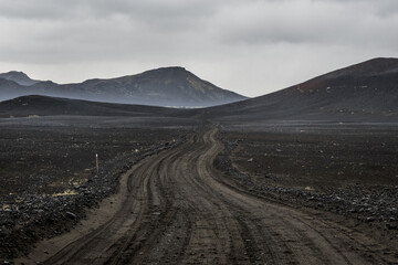 Road along black lava fields