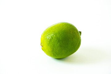 Macro Fruit: Ripe lime with white background, horizontal format with copy space