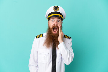 Redhead caucasian man playing rugby isolated on yellow background with surprise and shocked facial expression