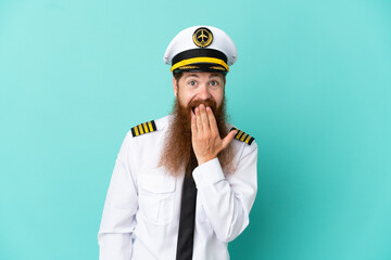 Redhead caucasian man playing rugby isolated on yellow background happy and smiling covering mouth with hand