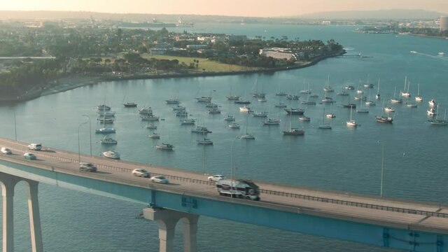 Aerial: yachts docked in the San Diego Bay and the Coronado Bridge, California, USA
