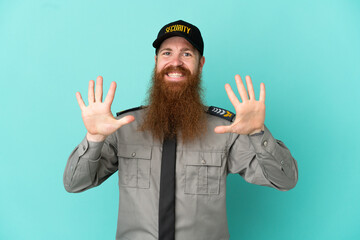 Redhead security man isolated on white background counting ten with fingers