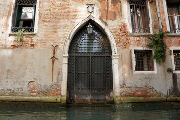 Tourist atmosphere of ancient Venice - the city of canals, gondolas and ancient architecture
