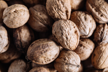 Food background made of walnuts, top view