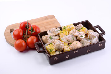 raw fish marinated in prtvin for roasting in the oven 