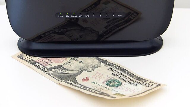 Internet usage fee increase during covid-19 period, modem and 10 dollars stand next to it,